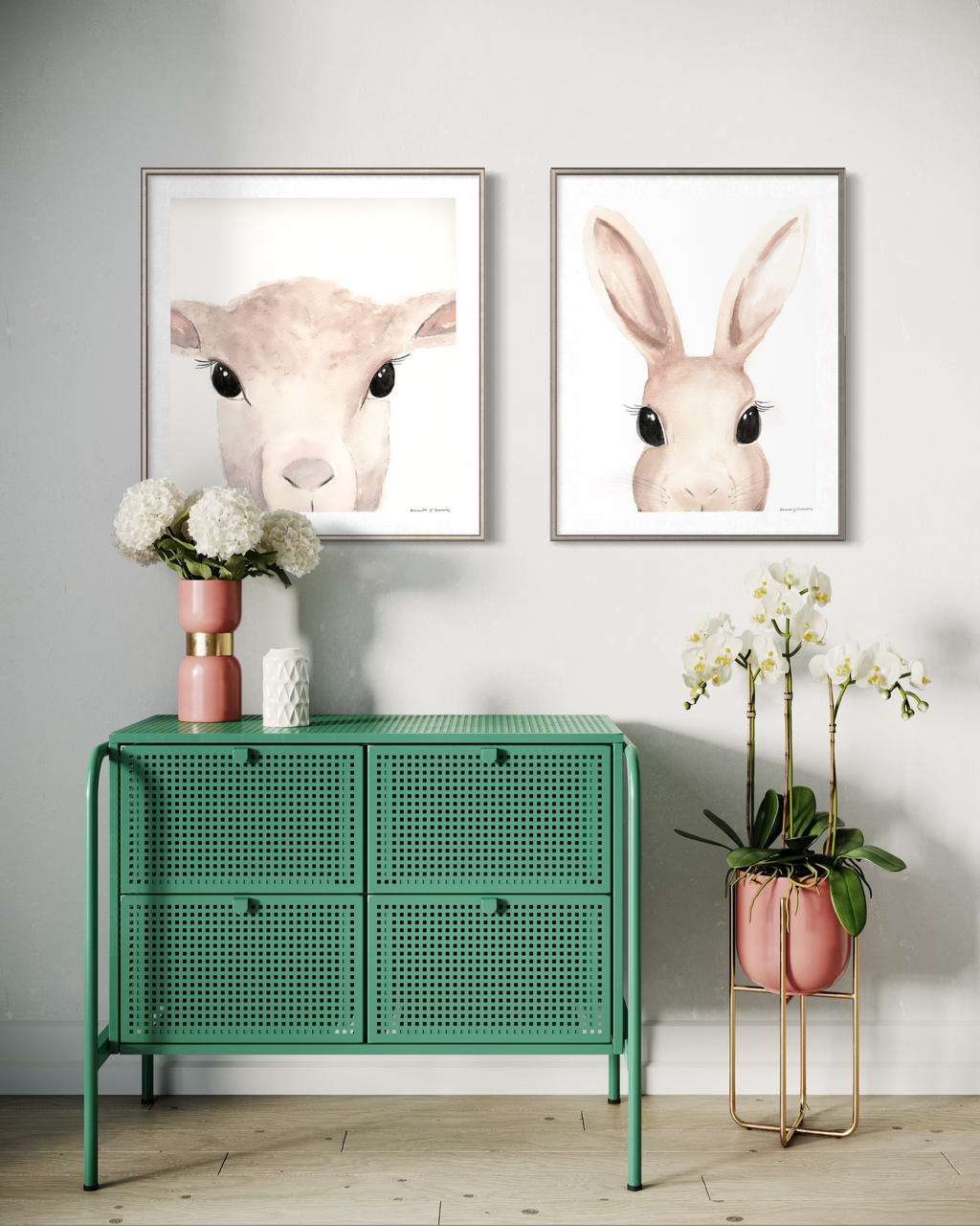 A sophisticated duo of minimalist watercolor animal portraits featuring a lamb and a bunny, staged together on a neutral wall. This pair of hand-painted Easter art prints creates a cohesive, modern spring gallery display.