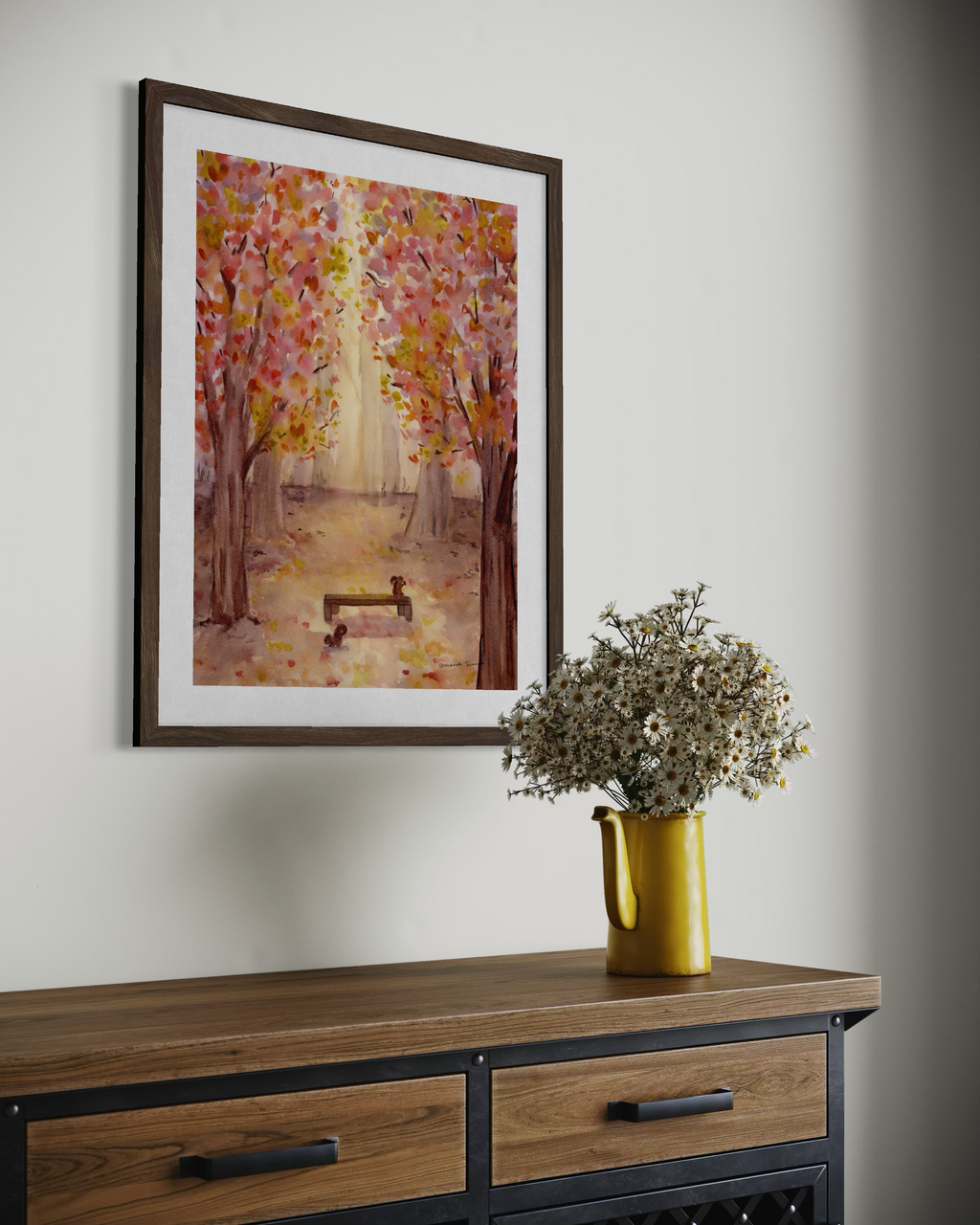 Original watercolor painting of a sunlit autumn forest path with vibrant pink, yellow, and orange foliage framing a wooden park bench with two squirrels.