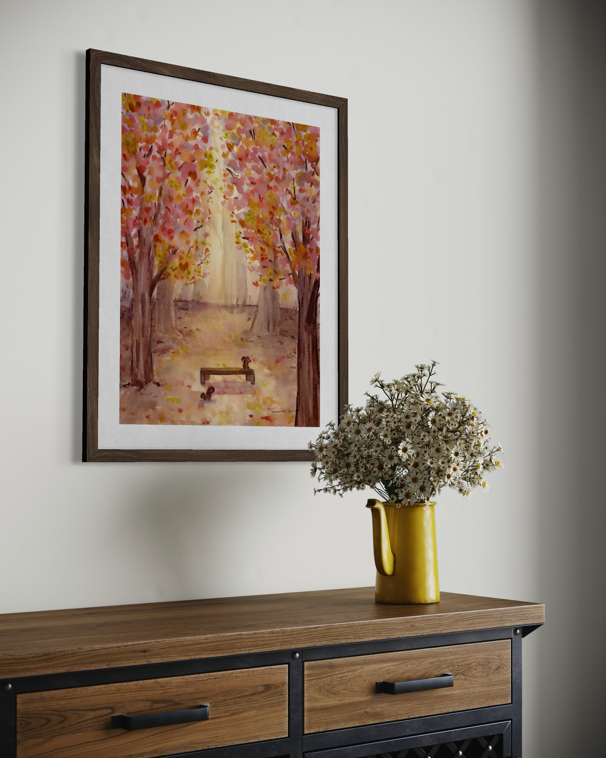 Original watercolor painting of a sunlit autumn forest path with vibrant pink, yellow, and orange foliage framing a wooden park bench with two squirrels.