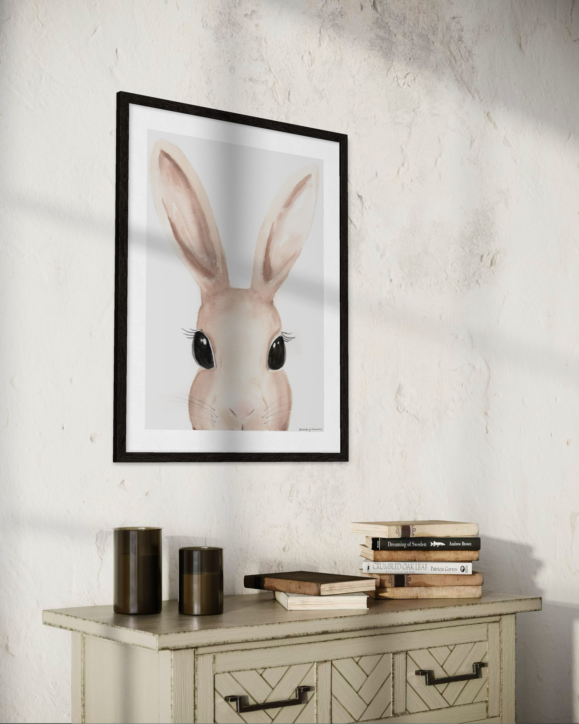 Close-up watercolor portrait of a rabbit with large, soft-wash ears and expressive dark eyes, rendered in sophisticated warm taupe tones on a clean white background. Perfect for a curated Easter art collection.
